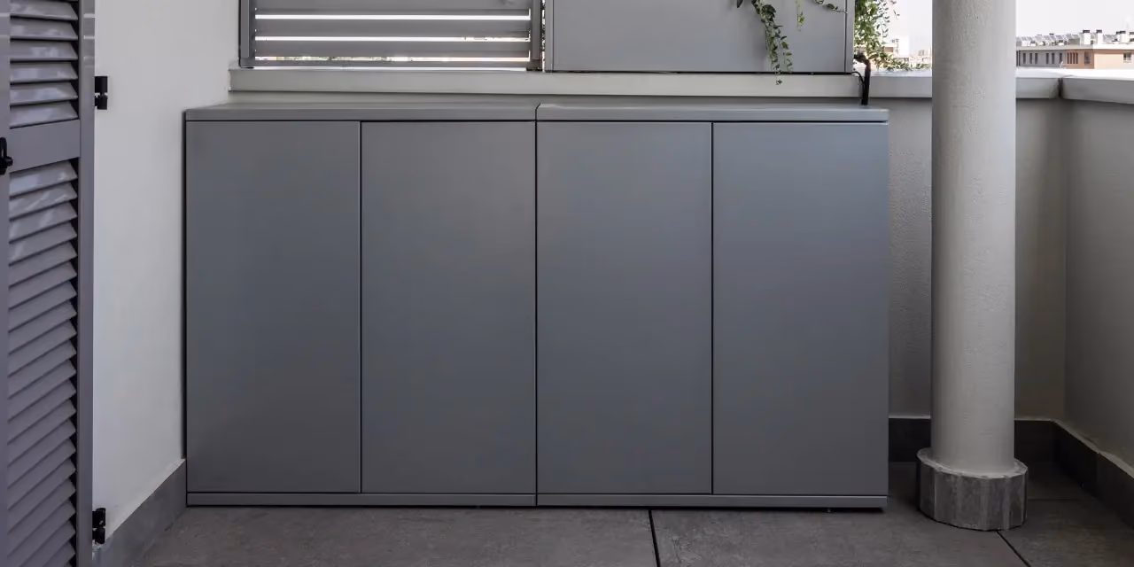 Outdoor kitchen unit in dark grey steel with flush full-height doors