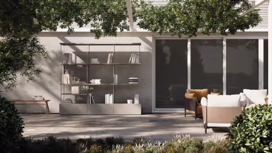 Libreria da esterno Modularte modello Green Book: scaffalatura modulare in metallo per terrazzo e giardino con sedute lounge coordinate.